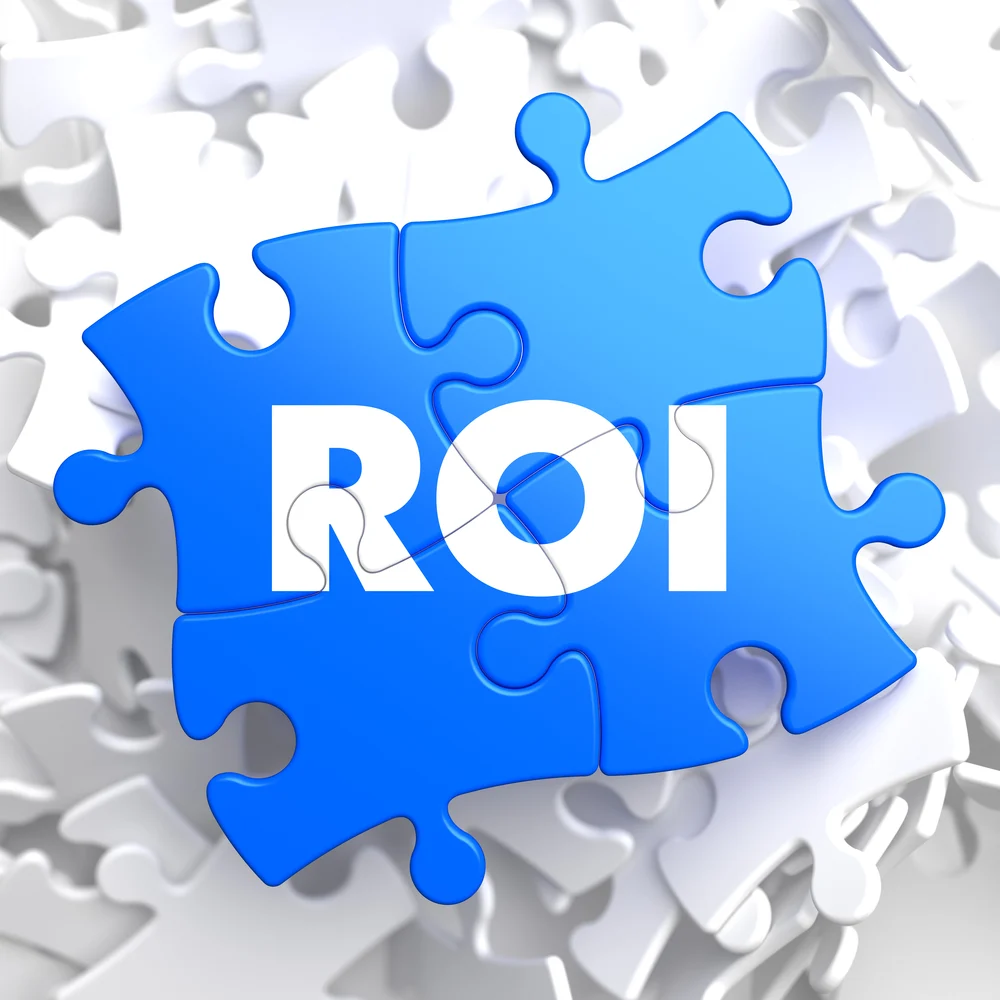 ROI - Return Of Investment - Written on Blue Puzzle Pieces